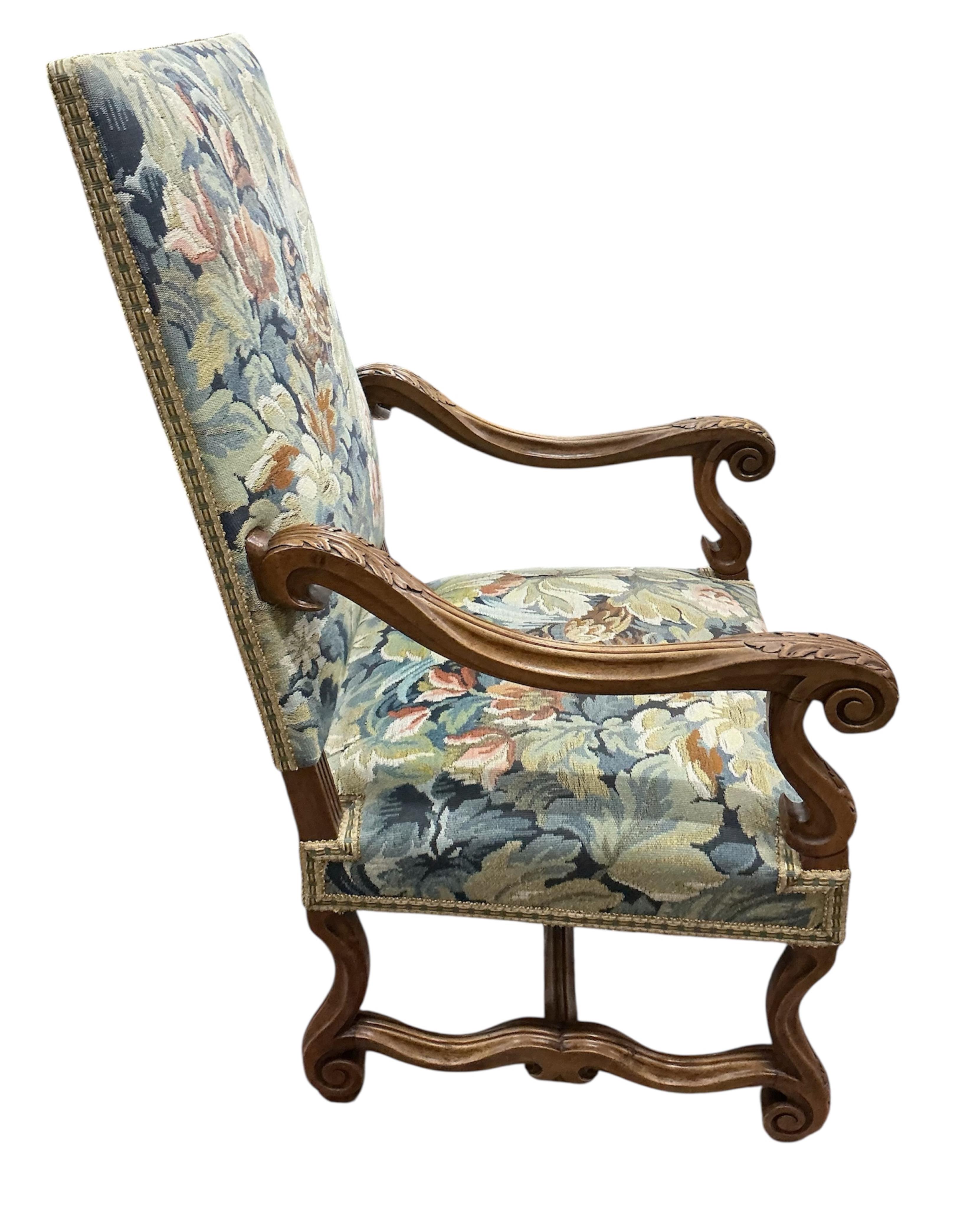 A pair of Louis XIII style walnut armchairs with tapestry upholstery, width 63cm, depth 63cm, height 115cm